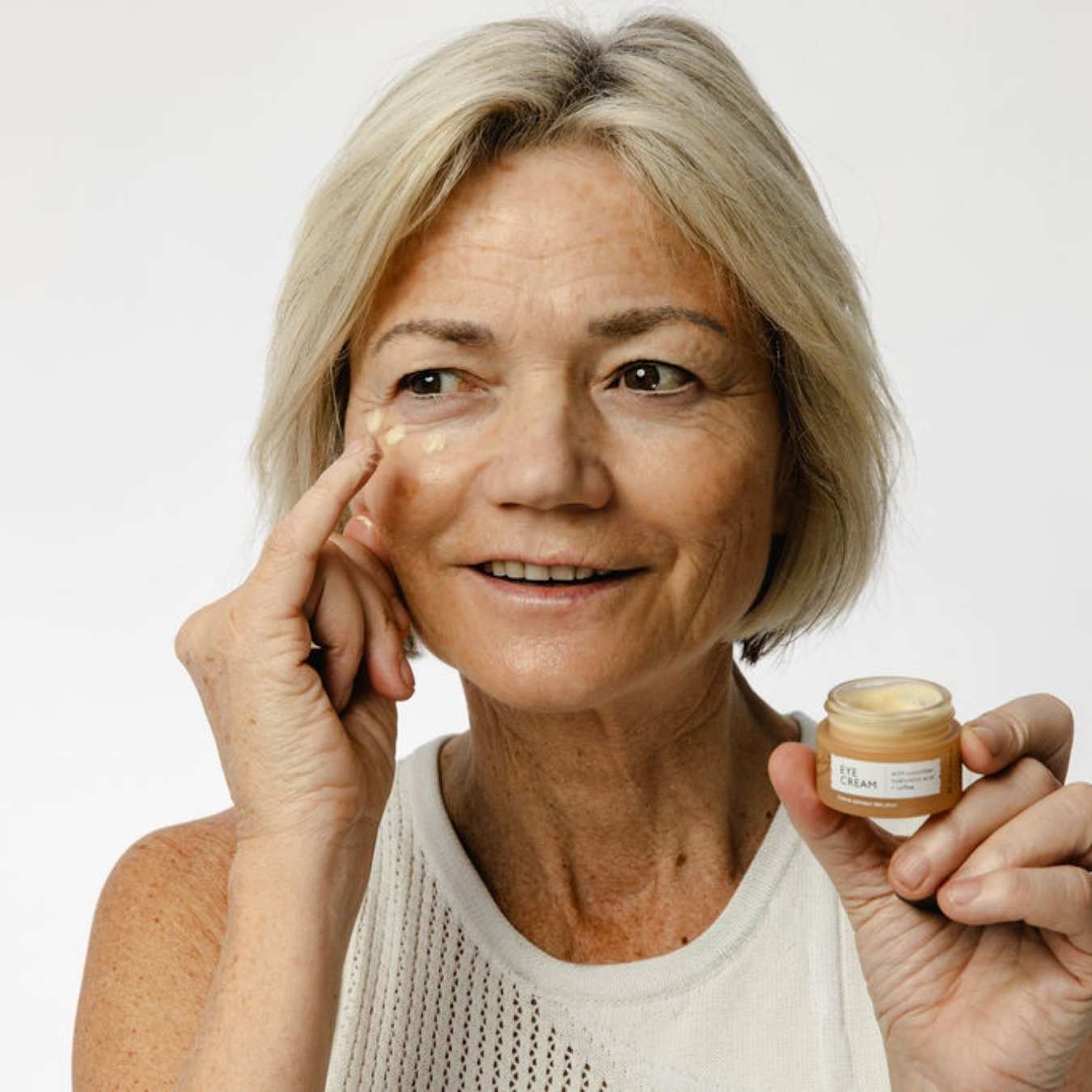 "Hyaluronic acid eye cream with coffee by UpCircle, glass jar product view"