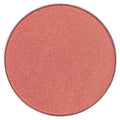 "Pressed powder blush flatlay with makeup brush"
